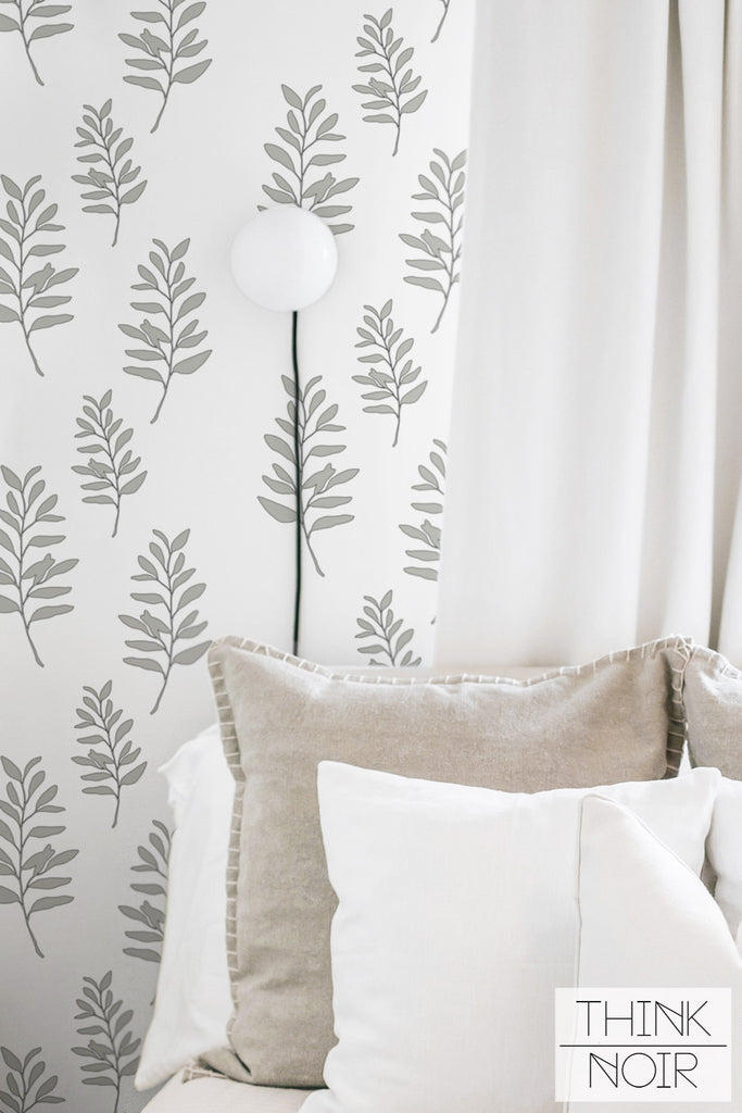neutral and cozy interior with botanical leaf print wallpaper in kids room
