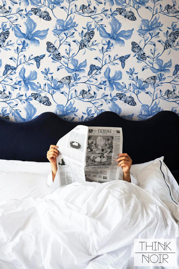 Light Blue painted floral vintage print wallpaper in cozy bedroom