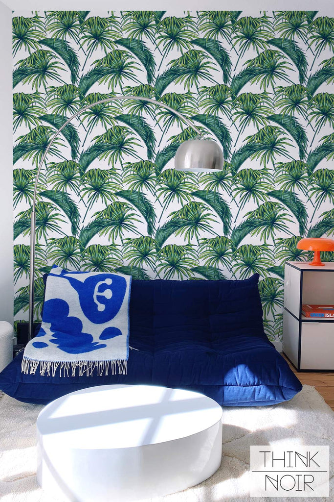 Tropical leaves wallpaper in eclectic living room interior