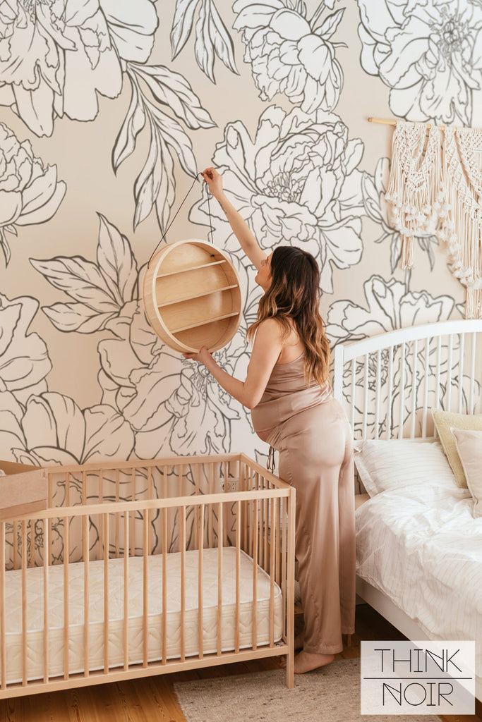 calm nursery interior with large scale floral wall mural