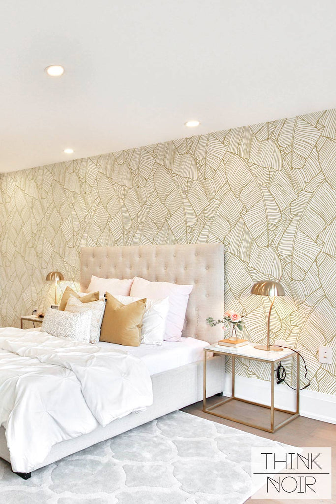 elegant bedroom interior with accent gold wallpaper
