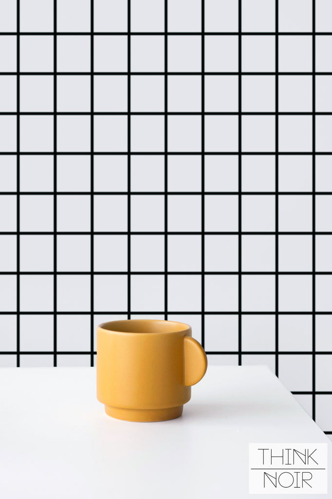 Scandi checker pattern wallpaper with bright yellow mug