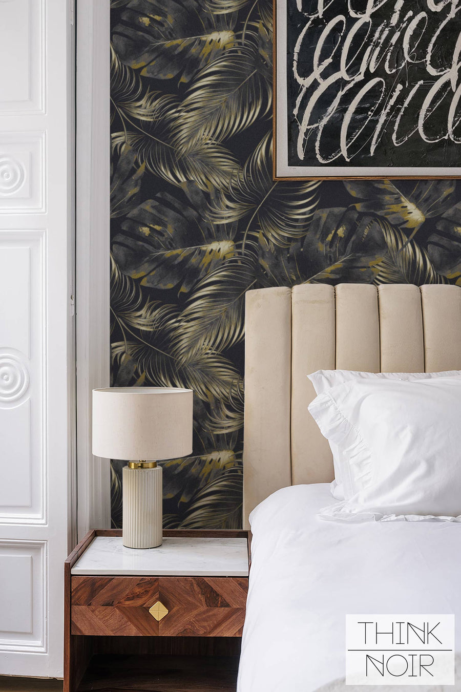 Wallpaper with a moody luxury tropical design.