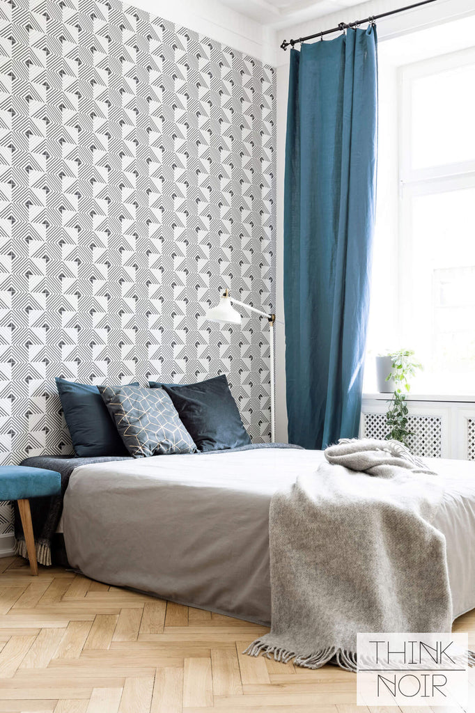 Simple geometric wallpaper accent wall in bedroom interior