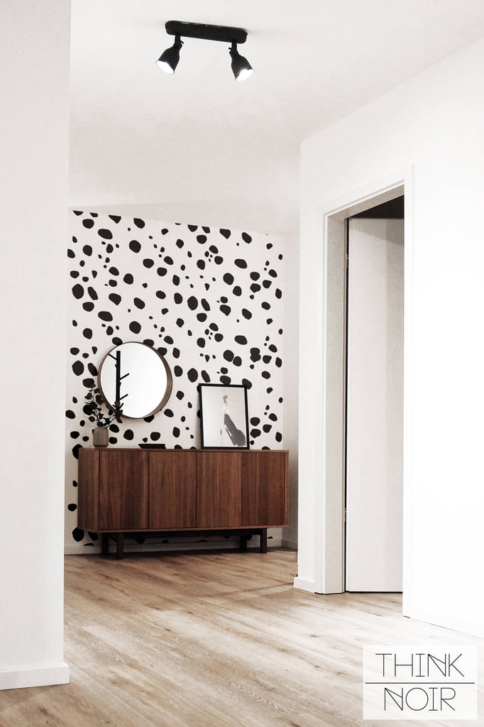 Boutique hotel entryway interior with accent wall mural