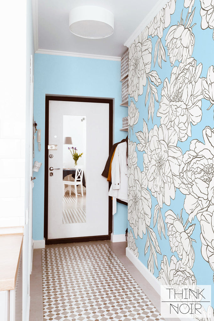 French apartment entryway with blue floral wallpaper