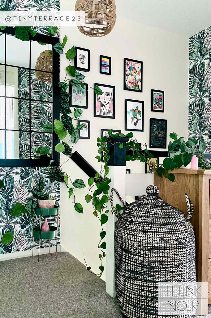 entryway design with tropical leaves print wallpaper